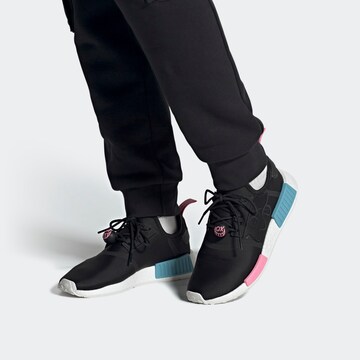 ADIDAS ORIGINALS Sneakers 'NMD_R1 x André Saraiva' in Black