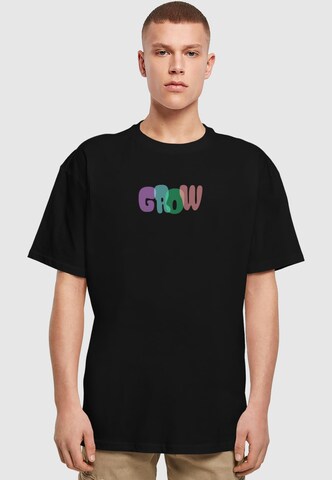 Merchcode Shirt 'Wording - Grow' in Schwarz: Vorderseite