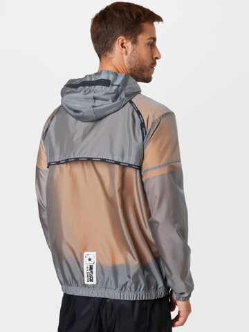 NIKE Sportjacke in Grau