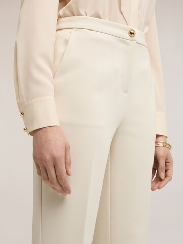 MOTIVI Flared Trousers in White