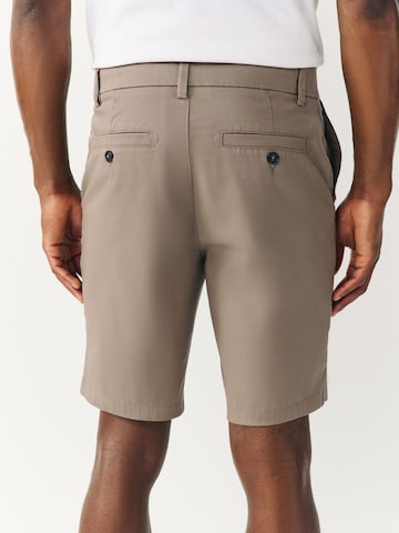 Next Slimfit Shorts in Braun