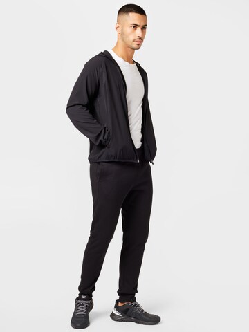 Champion Authentic Athletic Apparel Jacke in Schwarz