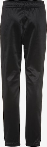 Effilé Pantalon de sport NIKE en noir