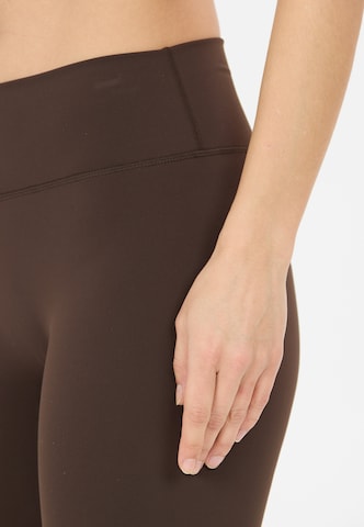Athlecia Skinny Sportbroek 'Emarri' in Bruin
