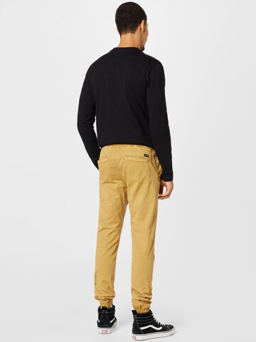 INDICODE JEANS - Tapered Calças 'Fields' em amarelo