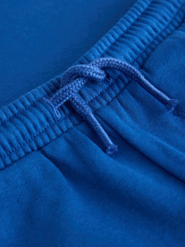 Next - Ropa para correr en azul