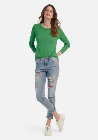 Pull-over include en vert