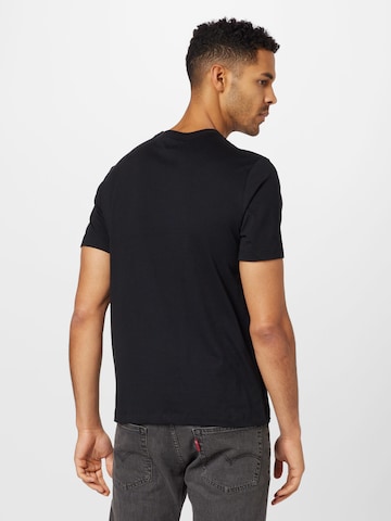 Nike Sportswear Majica 'Futura 2' | črna barva