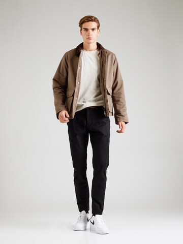 Tapered Pantaloni chino di Calvin Klein Jeans in nero