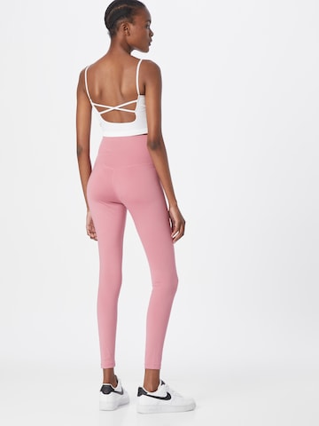 NIKE Skinny Spodnie sportowe 'One' w kolorze różowy