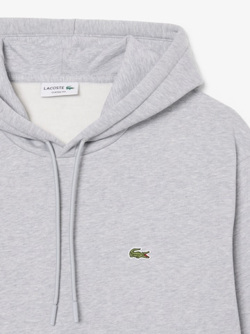 LACOSTE Tréning póló - szürke