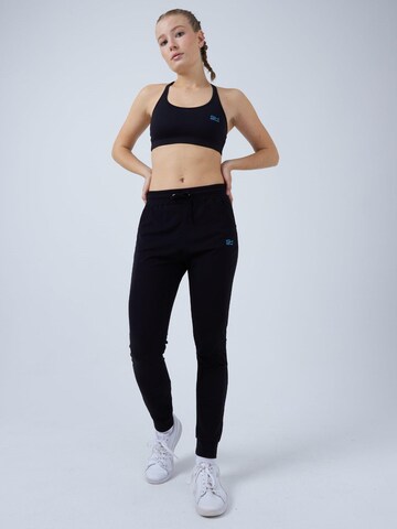 SPORTKIND - Loosefit Pantalón deportivo 'Jogging Pants' en negro