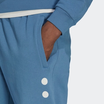 Tapered Pantaloni 'Reclaim Logo' di ADIDAS ORIGINALS in blu