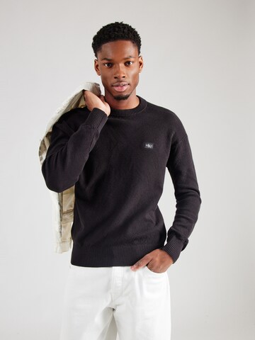 Pull-over Calvin Klein Jeans en noir : devant