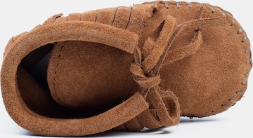 Minnetonka Slippers in Brown