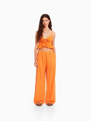 Bershka Szeroka nogawka Spodnie w kolorze pomarańczowy