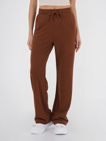 FRESHLIONS Flared Pants in Brown: front