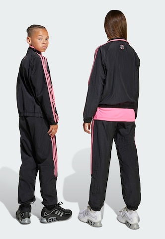 Tapered Pantaloni 'Teamgeist' di ADIDAS ORIGINALS in nero