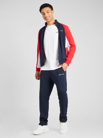 Champion Authentic Athletic Apparel Tracksuit in Blue: front