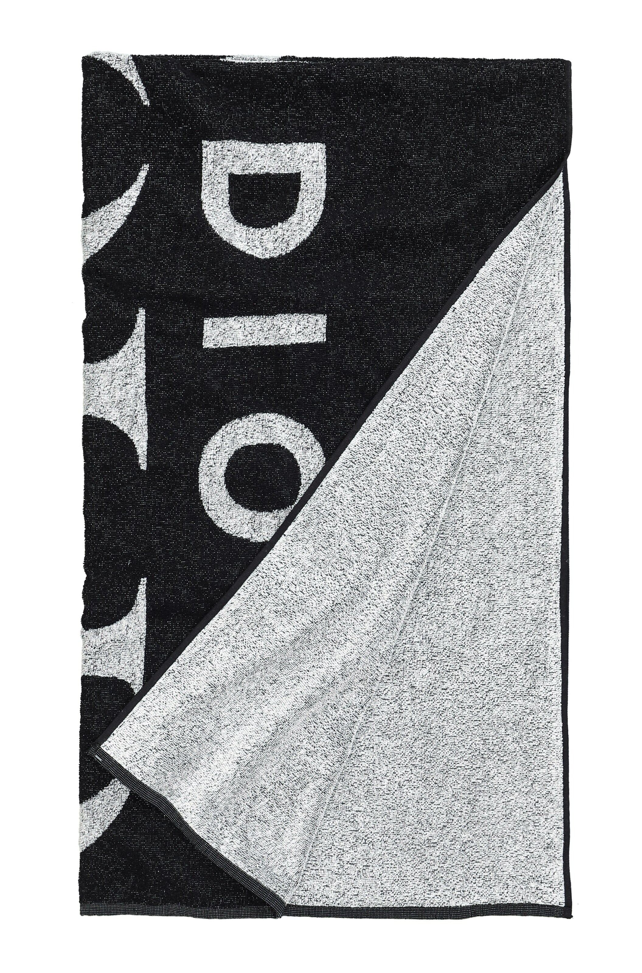 Serviette de plage Studio Untold en noir : devant