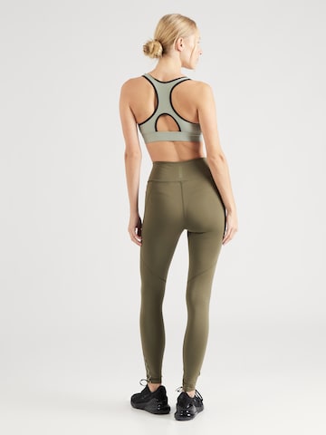 UNDER ARMOUR Skinny Športne hlače 'Fly Fast 3.0' | zelena barva