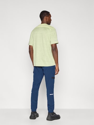 UNDER ARMOUR - Tapered Pantalón deportivo 'Tech Utility' en azul