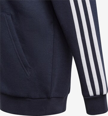 ADIDAS SPORTSWEAR Спортна жилетка с качулка 'Essentials' в синьо