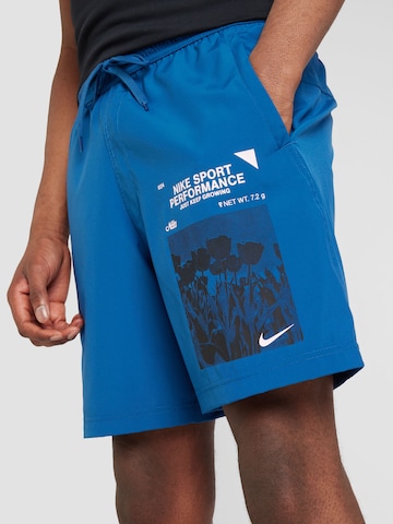 NIKE - Regular Calças de desporto em azul
