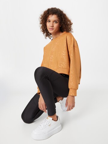 PUMA Sport sweatshirt 'Fashion Luxe Embossed' i brun