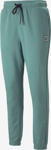 PUMA Workout Pants 'Pivot' in Green: front