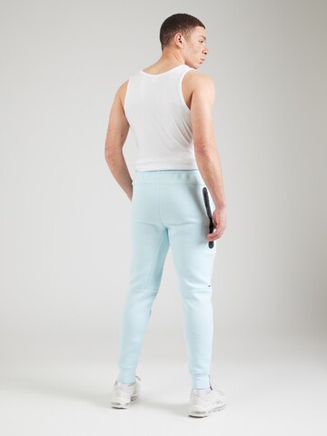 Nike Sportswear Tapered Nadrág 'TCH FLC' - kék
