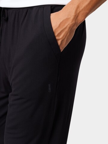 CURARE Yogawear Tapered Sporthose in Schwarz