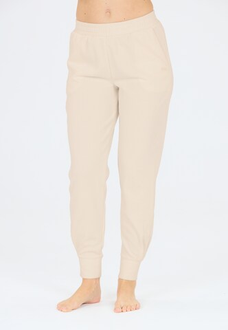Athlecia Regular Sports trousers in Brown: front