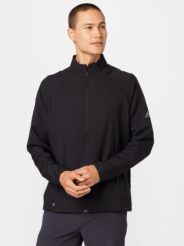 ADIDAS GOLF - Chaqueta de chándal en negro: frente