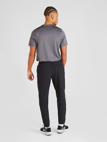 NIKE Tapered Sportsbukser 'Unlimited' i sort