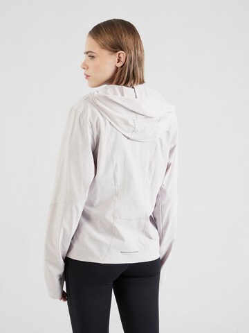 NIKE Sportjacke 'SWIFT' in Lila