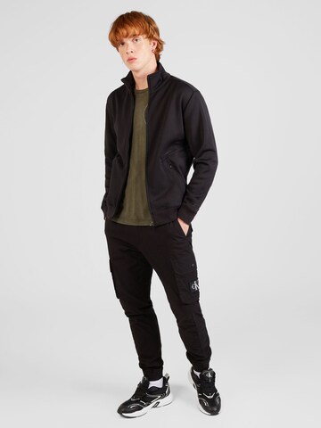 Champion Authentic Athletic Apparel Sweatjacka 'Tech' i svart