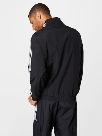ADIDAS ORIGINALS Prehodna jakna 'Adicolor Classics Lock-Up Trefoil' | črna barva