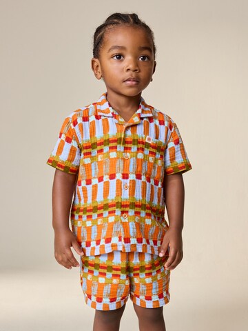 Next Sada – oranžová: přední strana