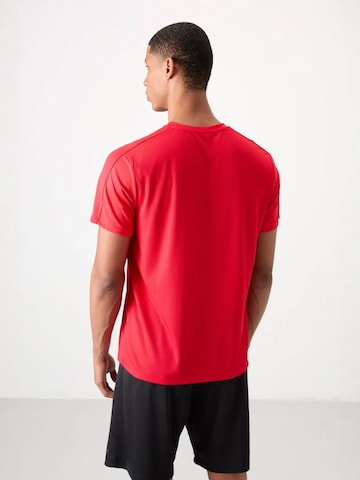 T-Shirt fonctionnel Tommy Life en rouge