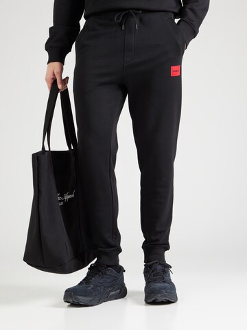 Effilé Pantalon 'Doak' HUGO en noir : devant