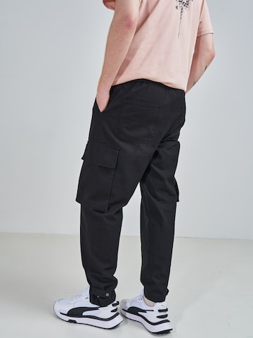 ABOUT YOU x Swalina&Linus Regular Cargo trousers 'Marlo' in Black