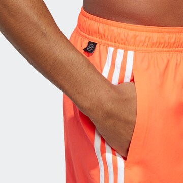 ADIDAS SPORTSWEAR Board shorts in Red