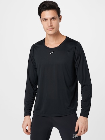 Nike Sportswear Performance Shirt in Black: front