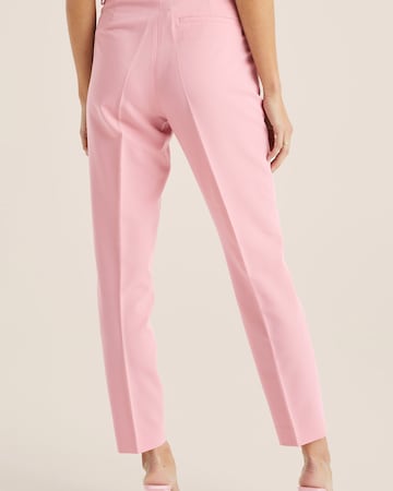 WE Fashion Slimfit Suorat housut värissä vaaleanpunainen
