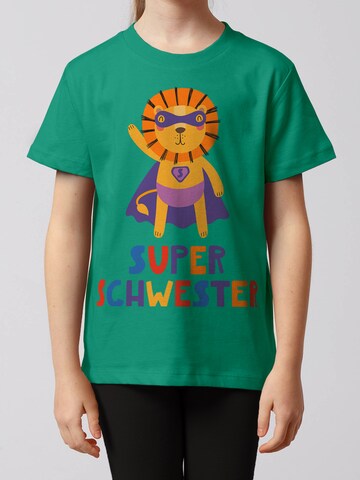 watabout.kids Shirt 'Löwe Superschwester' in Green: front