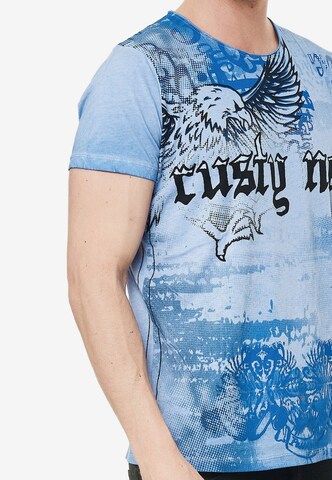 Rusty Neal Cooles T-Shirt mit Allover-Print in Blau