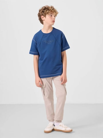 Pantalon 'TOMMY Kinder Cargo-Joggerhose' Tommy Life en gris : devant