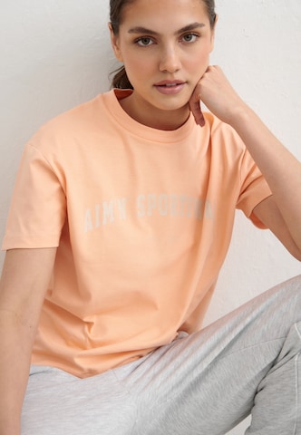Aim'n - Camisa funcionais 'Varsity' em laranja