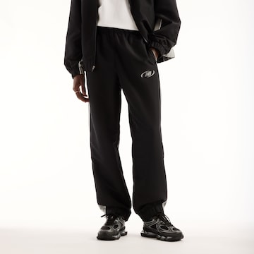 new balance - Tapered Pantalón en negro: frente